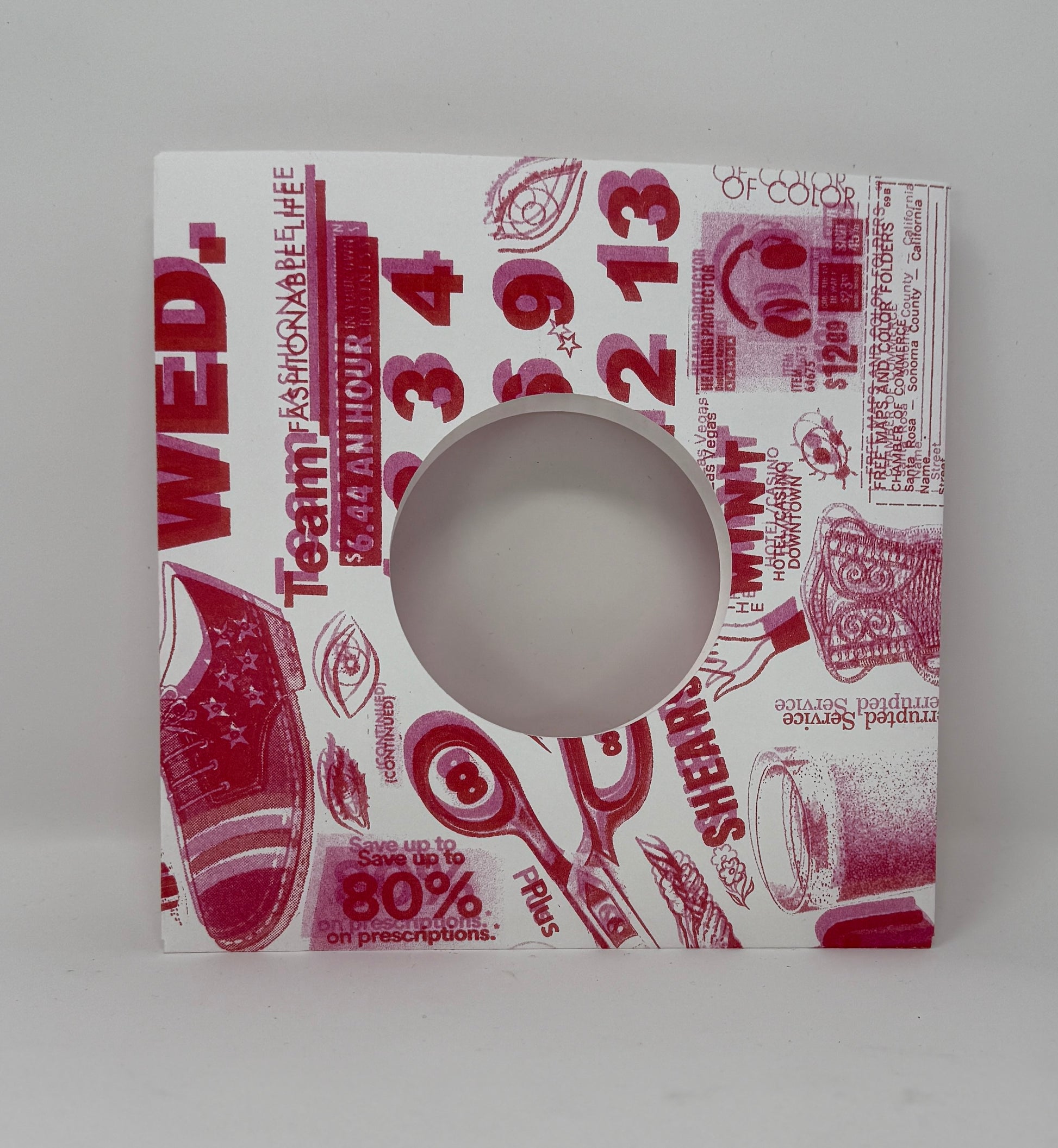 7" Record sleeve in heavy cardstock in Bogus print in red and pink