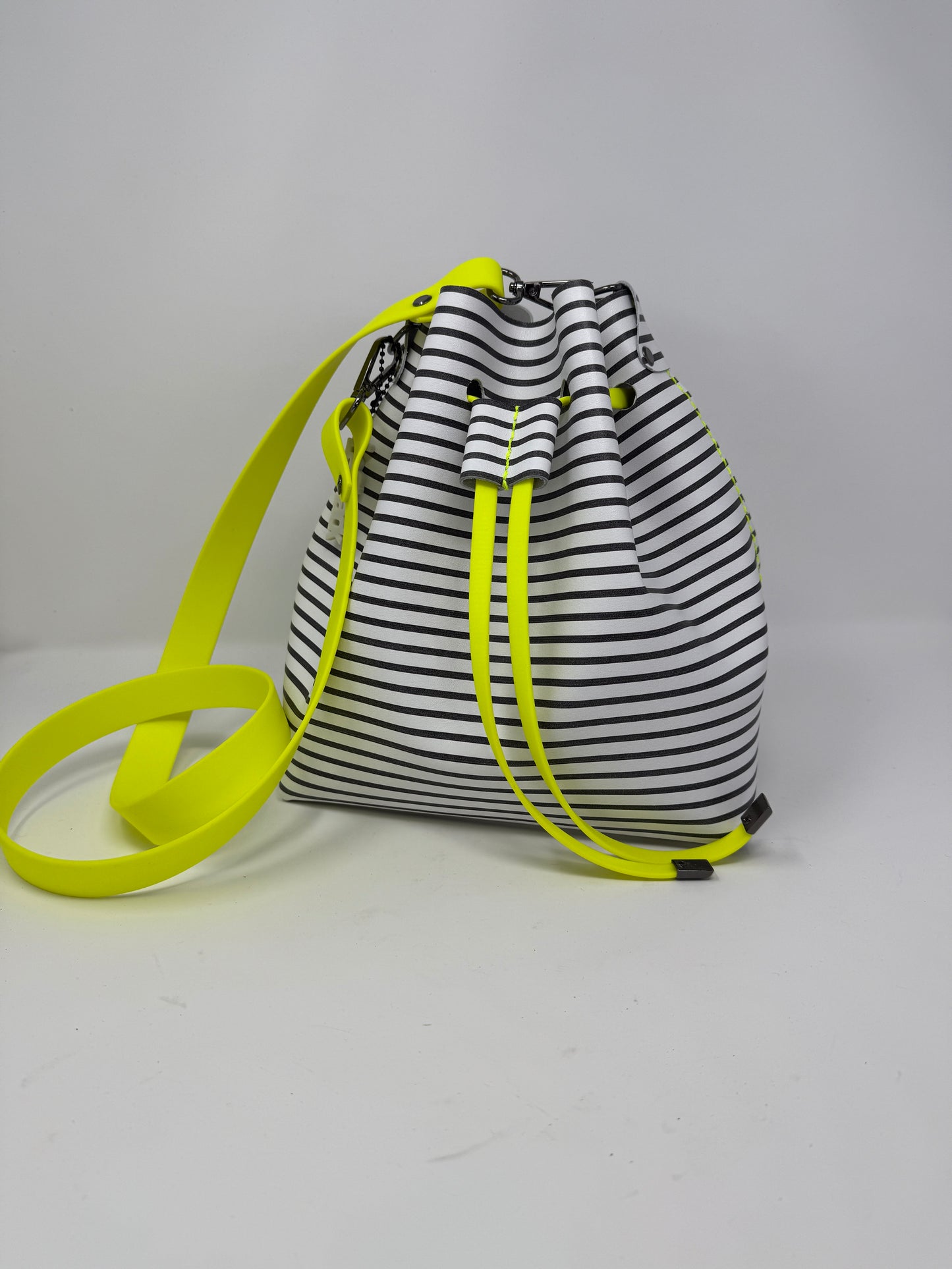 Black and White Striped Leather Drawstring Bucket Crossbody Bag