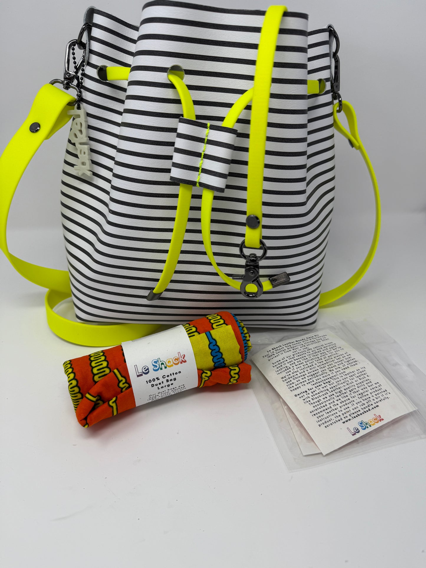 Black and White Striped Leather Drawstring Bucket Crossbody Bag