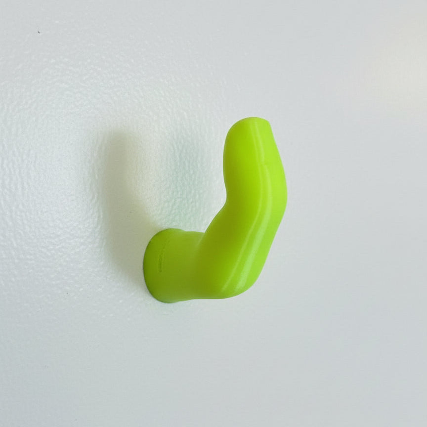 Neon Yellow finger hook on white wall